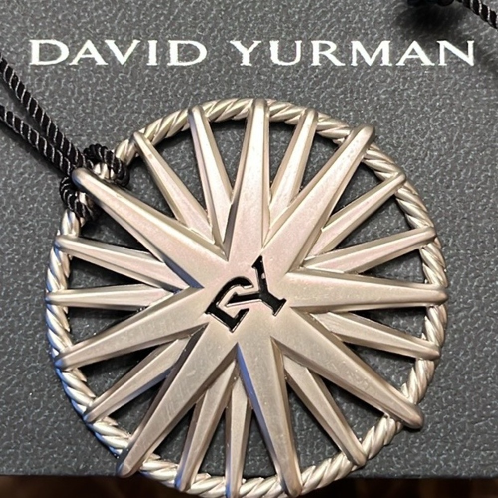FOLLOW ME.    David Yurman Star NorthStar ornament.More available in my closet